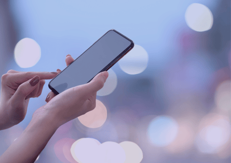 woman's hand holding a phone